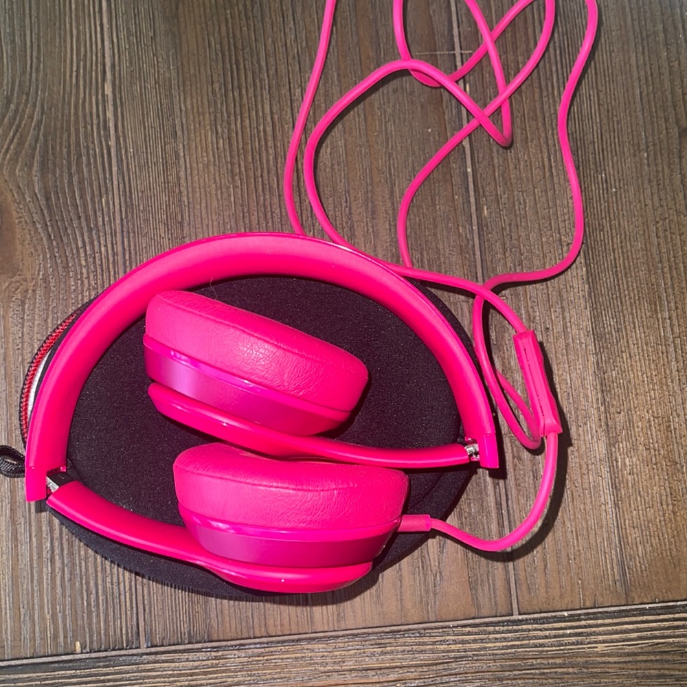 Hot pink Beats headphones
